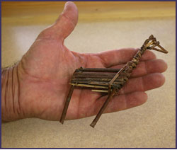 Replica of a split-twig figurine believed to represent a deer. Replica created by Paul Ermigiotti. Photo by Joyce Heuman Kramer; copyright Crow Canyon Archaeological Center.